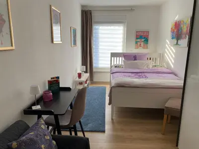 Ein Bett oder Betten in einem Zimmer der Unterkunft Ruhige und zentral gelegene Ferienwohnung