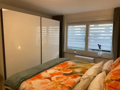 Ein Bett oder Betten in einem Zimmer der Unterkunft Ruhige und zentral gelegene Ferienwohnung