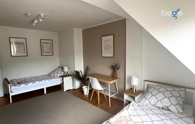 Ein Bett oder Betten in einem Zimmer der Unterkunft BEGE APARTMENTS WorkHub Retreat