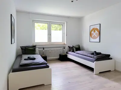 Ein Bett oder Betten in einem Zimmer der Unterkunft 3 BR Nice Apartment Gelsenkirchen