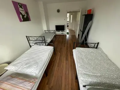 Ein Bett oder Betten in einem Zimmer der Unterkunft MAD Ferienwohnungen 3