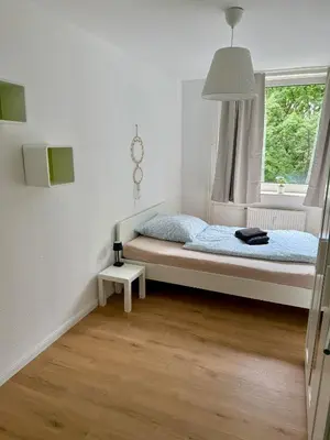 Ein Bett oder Betten in einem Zimmer der Unterkunft Comfy Modern 4-Bed Apartment, WiFi, 20min DUS, 5min A46