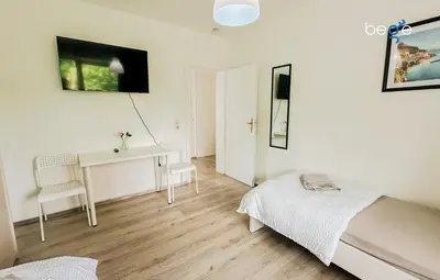 Ein Bett oder Betten in einem Zimmer der Unterkunft BEGE APARTMENTS StayWell
