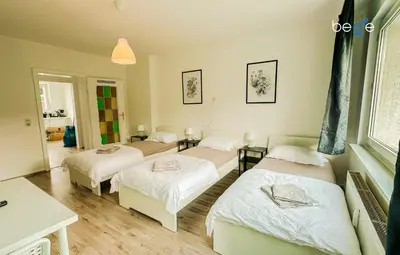 Ein Bett oder Betten in einem Zimmer der Unterkunft BEGE APARTMENTS StayWell