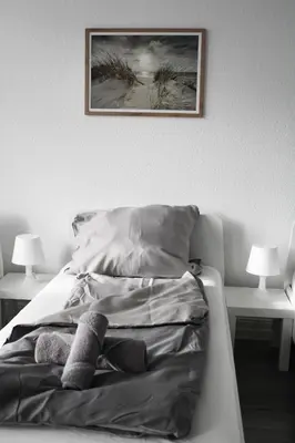 Ein Bett oder Betten in einem Zimmer der Unterkunft RuhrpottImmo - Zentrale Wohnung in Iserlohn - bis zu 7 Pers