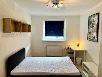 Ein Bett oder Betten in einem Zimmer der Unterkunft New fully equipped apartment with private parking space