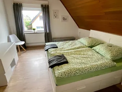 Ein Bett oder Betten in einem Zimmer der Unterkunft Ferienwohnung Gisela