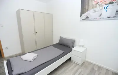 Ein Bett oder Betten in einem Zimmer der Unterkunft BEGE APARTMENTS NomaStay