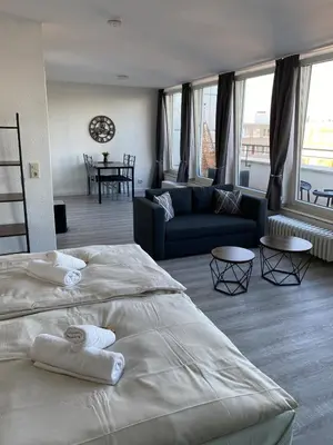 Ein Bett oder Betten in einem Zimmer der Unterkunft City Appartment