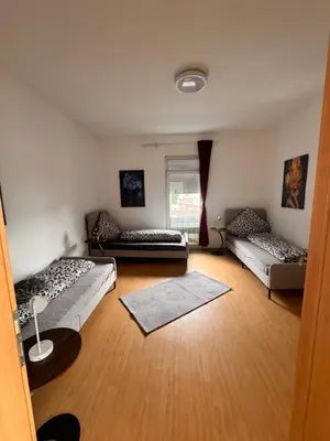 Ein Bett oder Betten in einem Zimmer der Unterkunft Iserlohn Ferienwohnung und Monteure
