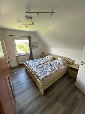 Ein Bett oder Betten in einem Zimmer der Unterkunft Ferienwohnung Frowein