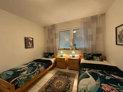 Ein Bett oder Betten in einem Zimmer der Unterkunft Citynahe Komfortwohnung für bis 6 Personen