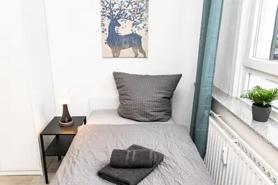 Ein Bett oder Betten in einem Zimmer der Unterkunft CosyHomes24 - centrally with balcony and garage - IL01b