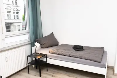 Ein Bett oder Betten in einem Zimmer der Unterkunft CosyHomes24 - centrally with balcony and garage - IL01b