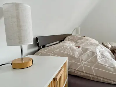 Ein Bett oder Betten in einem Zimmer der Unterkunft Komfort & Stil, Moderne Wohnung mit Fitnessraum