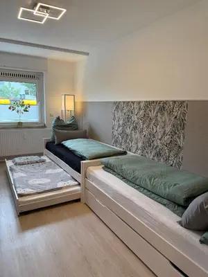 Ein Bett oder Betten in einem Zimmer der Unterkunft Feeling Home - Moderne 3-Zimmer Ferienwohnung am Uniklinikum, Nähe Messe und Rüttenscheid, 