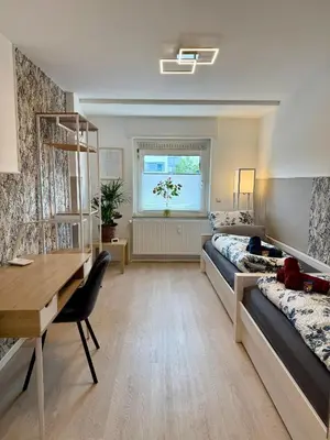 Ein Bett oder Betten in einem Zimmer der Unterkunft Feeling Home - Moderne 3-Zimmer Ferienwohnung am Uniklinikum, Nähe Messe und Rüttenscheid, 