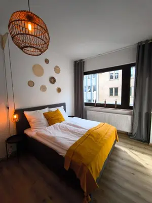 Ein Bett oder Betten in einem Zimmer der Unterkunft BioNaturSuite Kortum1745, HBF, Bermuda3Eck, Musikforum, Starlight Express, Museum