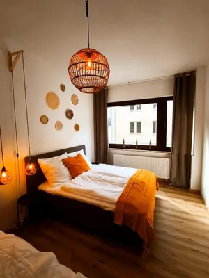 Ein Bett oder Betten in einem Zimmer der Unterkunft BioNaturSuite Kortum1745, HBF, Bermuda3Eck, Musikforum, Starlight Express, Museum