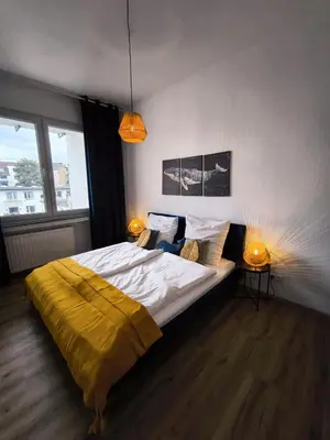 Ein Bett oder Betten in einem Zimmer der Unterkunft BioNaturSuite Kortum1745, HBF, Bermuda3Eck, Musikforum, Starlight Express, Museum