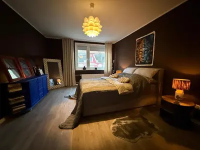 Ein Bett oder Betten in einem Zimmer der Unterkunft Rüttenscheid Design Apartment mit Balkon Office