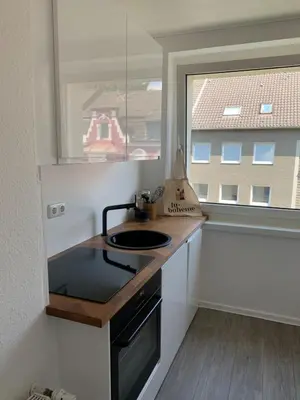 Küche/Küchenzeile in der Unterkunft Rüttenscheid Design Apartment mit Balkon Office