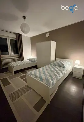 Ein Bett oder Betten in einem Zimmer der Unterkunft BEGE APARTMENTS StaySpace