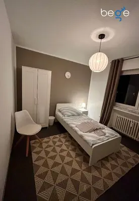 Ein Bett oder Betten in einem Zimmer der Unterkunft BEGE APARTMENTS StaySpace