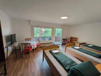 Ein Bett oder Betten in einem Zimmer der Unterkunft Unterkunft Uni-nähe mit Garten
