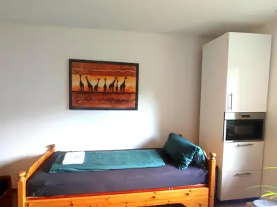 Ein Bett oder Betten in einem Zimmer der Unterkunft Unterkunft Uni-nähe mit Garten