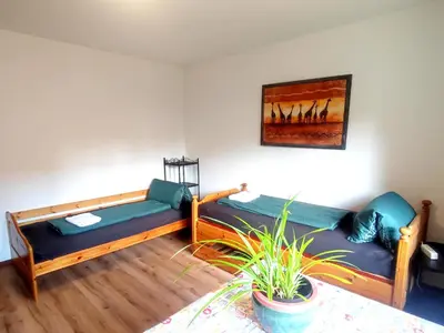 Ein Bett oder Betten in einem Zimmer der Unterkunft Unterkunft Uni-nähe mit Garten