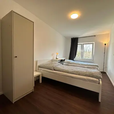 Ein Bett oder Betten in einem Zimmer der Unterkunft WDI - WorkersSpace 3