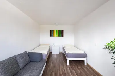 Ein Bett oder Betten in einem Zimmer der Unterkunft Geräumige Monteurwohnung in Ratingen mit WLAN und Parkplatz