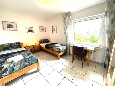 Ein Bett oder Betten in einem Zimmer der Unterkunft Gemütliche Komfortwohnung in ruhiger Grünlage - ideal für bis zu 3 Gäste