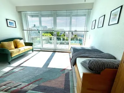 Ein Sitzbereich in der Unterkunft Ruhige Wohlfühloase auf zwei Ebenen - mit Terrasse im Grünen und Balkon