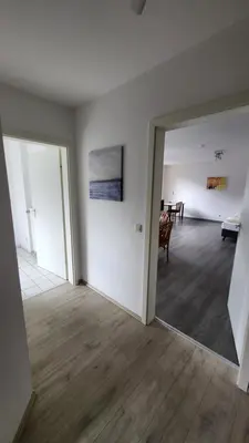 Ein Bett oder Betten in einem Zimmer der Unterkunft Appartementhaus Sudberg