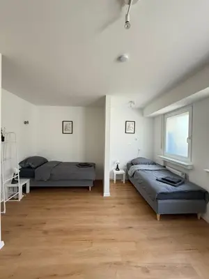 Ein Bett oder Betten in einem Zimmer der Unterkunft Moderne Ferienwohnung Ratingen