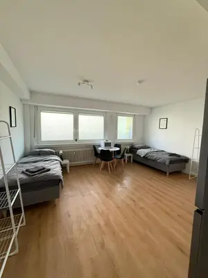Ein Bett oder Betten in einem Zimmer der Unterkunft Moderne Ferienwohnung Ratingen