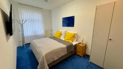 Ein Bett oder Betten in einem Zimmer der Unterkunft Charming Apartment in historischer Polizeiwache