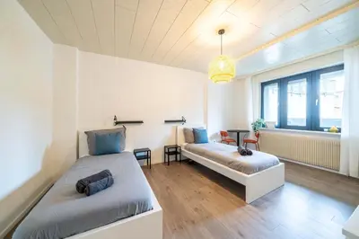 Ein Bett oder Betten in einem Zimmer der Unterkunft 6P Zentrale Suite mit Balkon & Parkplatz