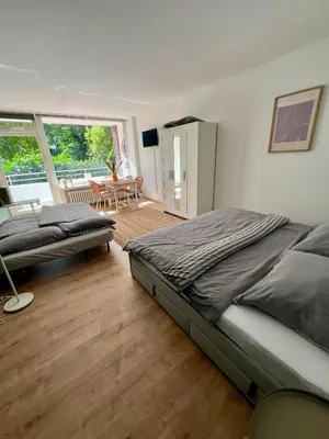 Ein Bett oder Betten in einem Zimmer der Unterkunft FairLoft - Messeloft - 5 Minutes to fair - 10 Minutes to city center