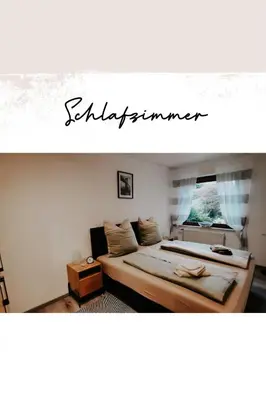 Ein Bett oder Betten in einem Zimmer der Unterkunft Ferienwohnung Höhendorf 5-Sterne-DTV