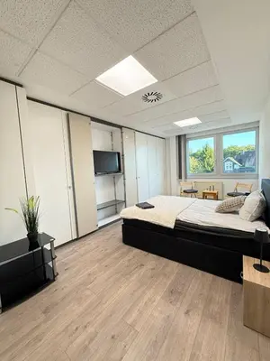 Ein Bett oder Betten in einem Zimmer der Unterkunft Ferienwohnung Remscheid UHF