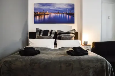 Ein Bett oder Betten in einem Zimmer der Unterkunft Centerapartments Tonhallenstraße