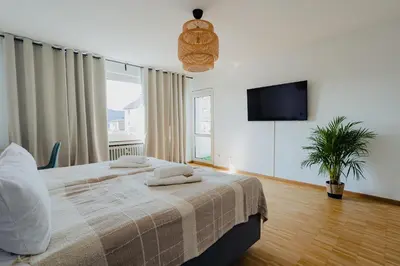 Ein Bett oder Betten in einem Zimmer der Unterkunft ATLAS Apartment Dinslaken, 3 Zimmer, Zentrum, Nähe Bahnhof, Balkon