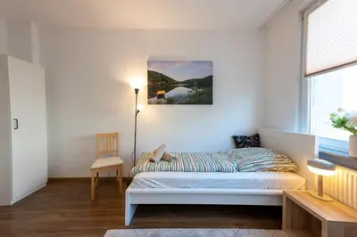 Ein Bett oder Betten in einem Zimmer der Unterkunft HagenStay Bülow 1