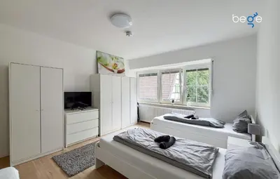 Ein Bett oder Betten in einem Zimmer der Unterkunft BEGE APARTMENTS UrbanWork