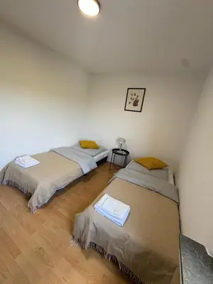 Ein Bett oder Betten in einem Zimmer der Unterkunft H&H Apartments