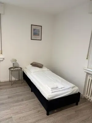 Ein Bett oder Betten in einem Zimmer der Unterkunft H&H Apartments