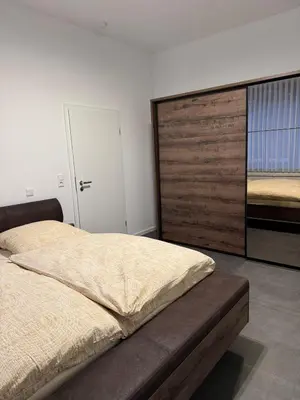 Ein Bett oder Betten in einem Zimmer der Unterkunft Ferienwohnung Alina